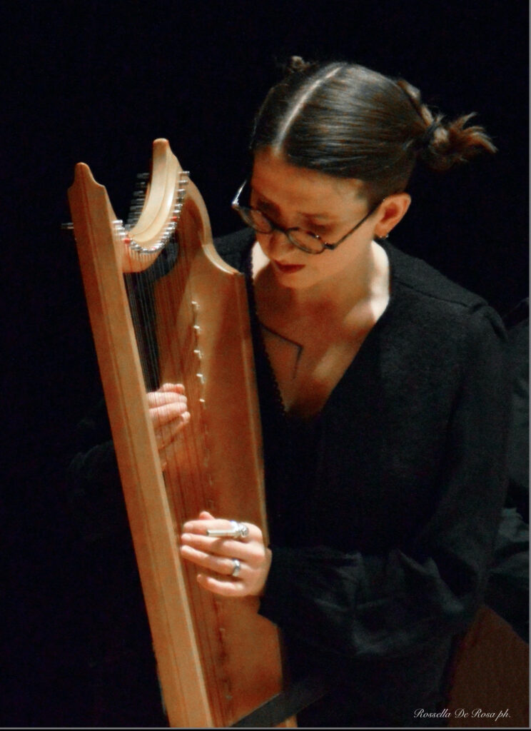 Harpist Leah Stuttard with bray gothic harp made by Eric Kleinmann